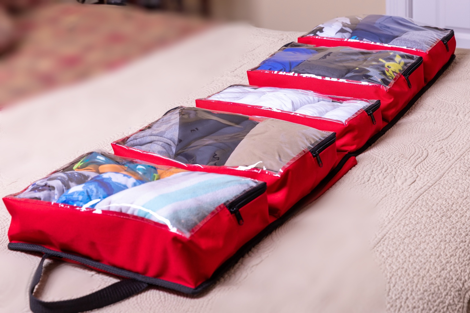 Red SuitcaseMate open and packed flat with clothing